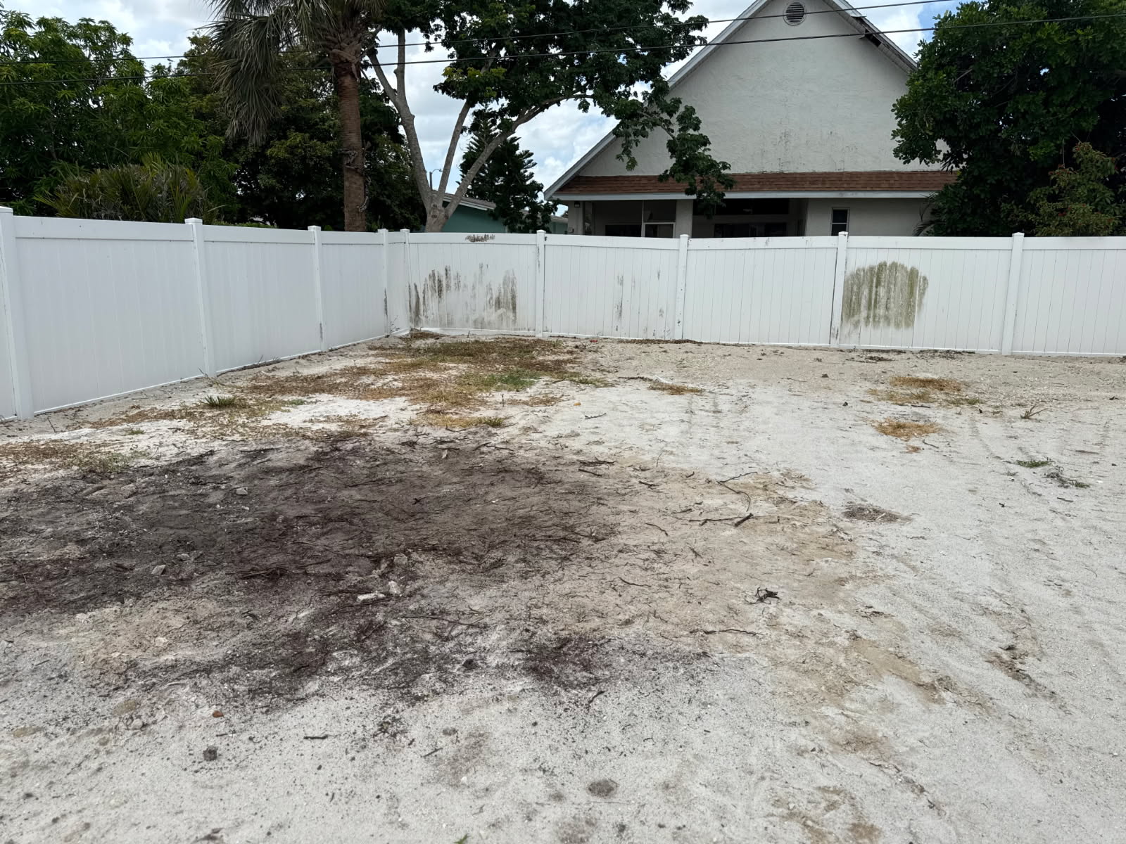 Cleared backyard after construction and paver debris removal by Triple H The Trash Kings in Fort Myers FL