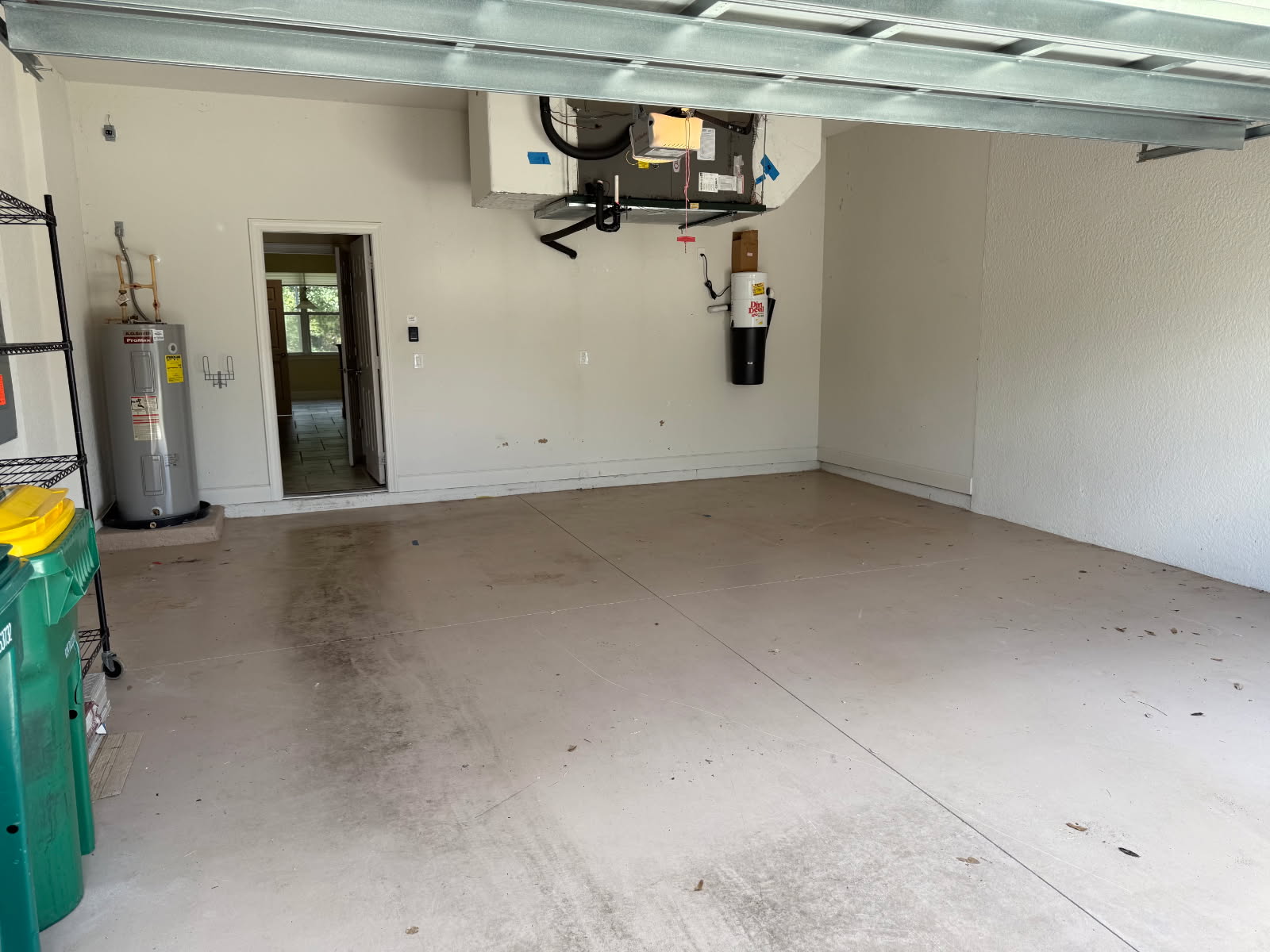 Empty swept garage after junk removal by Triple H The Trash Kings in Fort Myers FL